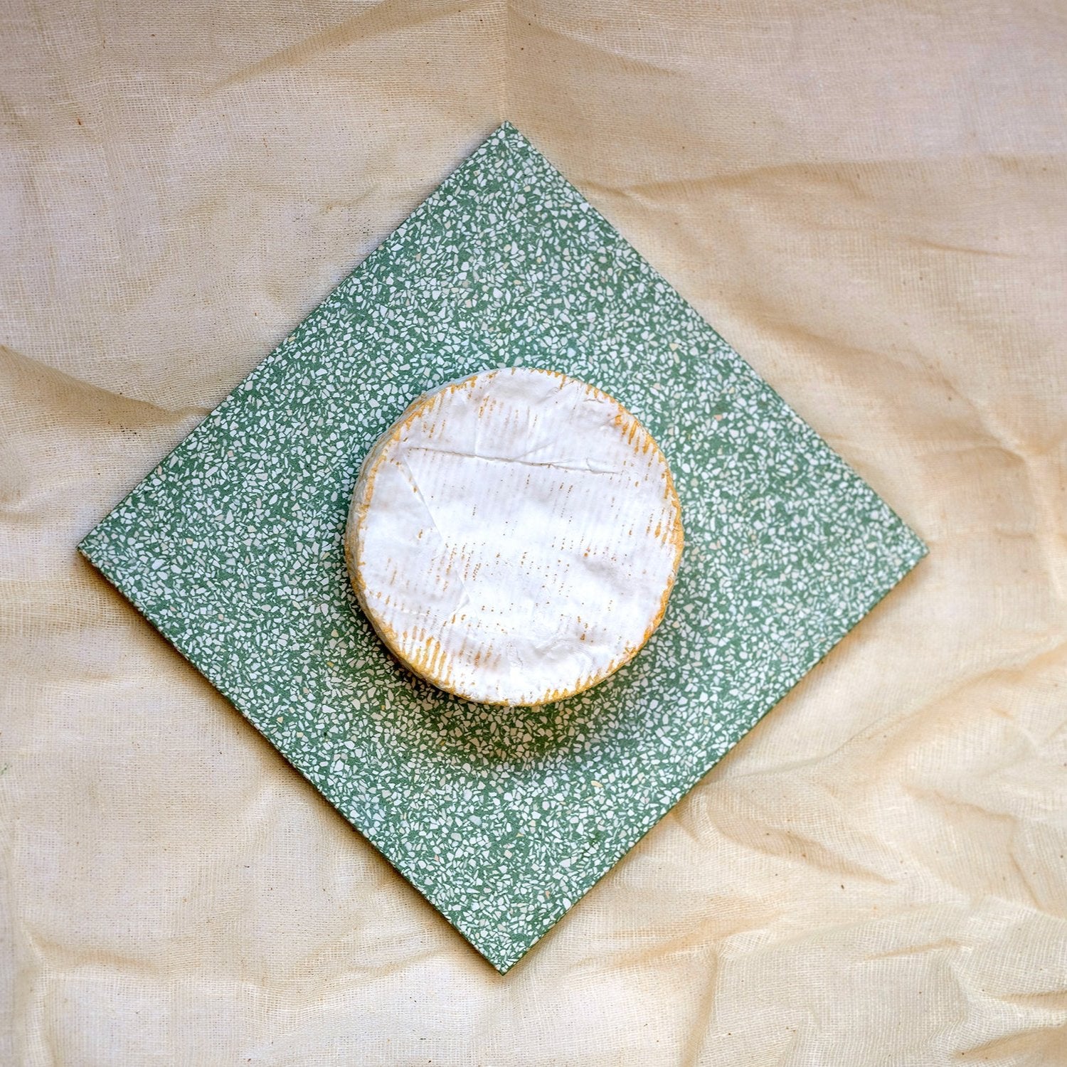 A complete Tunworth cheese 250 gram wheel from the Hampshire Cheese Co.