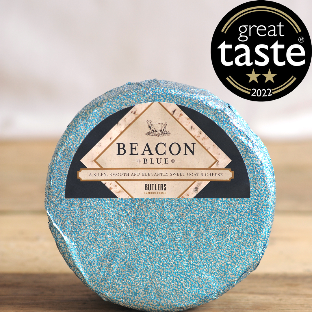 Beacon Blue, our award-winning blue goat's cheese in a wrapped cheese wheel.