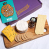 Overhead shot of the Perfect British Valentine's Cheeseboard with Crackers & Chutney on a cheeseboard