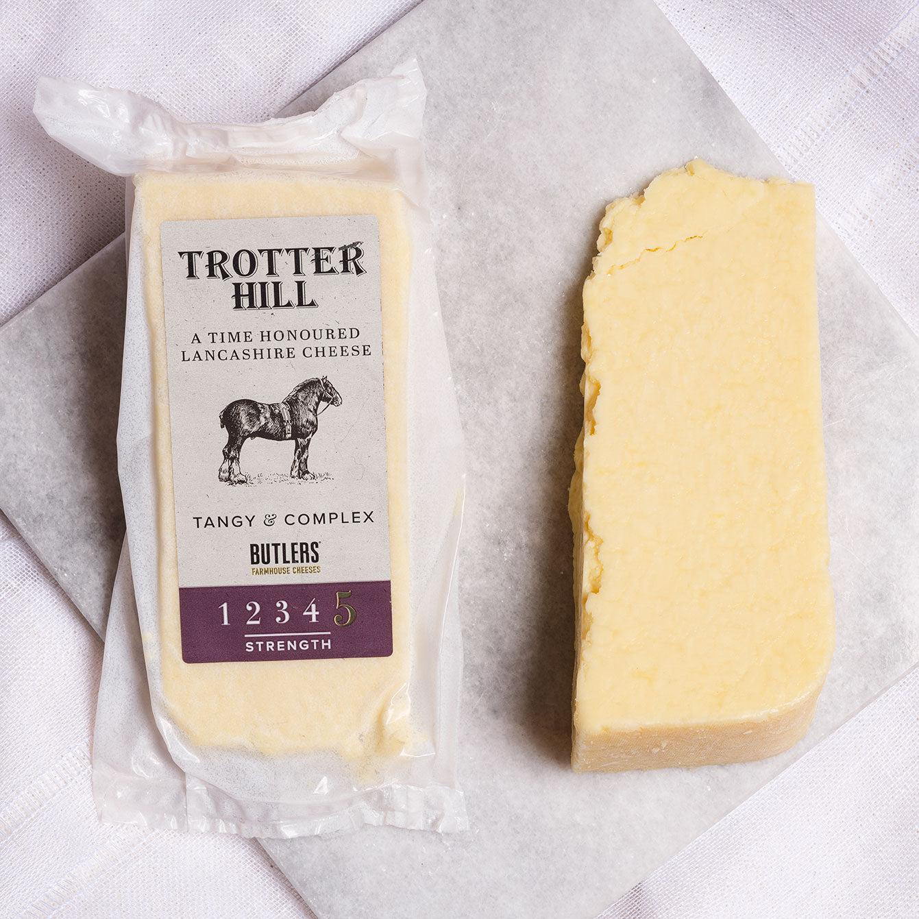 Trotter Hill a Handmade Lancashire Cheese in it's packaging and also as a wedge. Available from the Butler's Cheese Store.