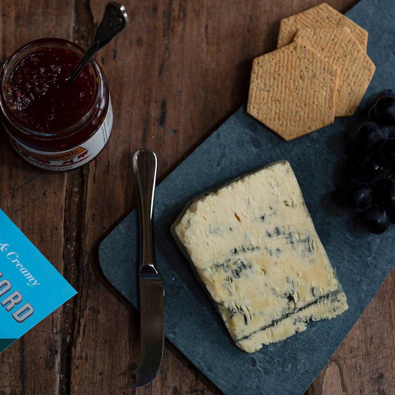 Stratford Blue cheese serving suggestion, served on a cheeseboard with crackers, grapes and relish. A creamy and rich blue cheese from Butler's Cheese Store.